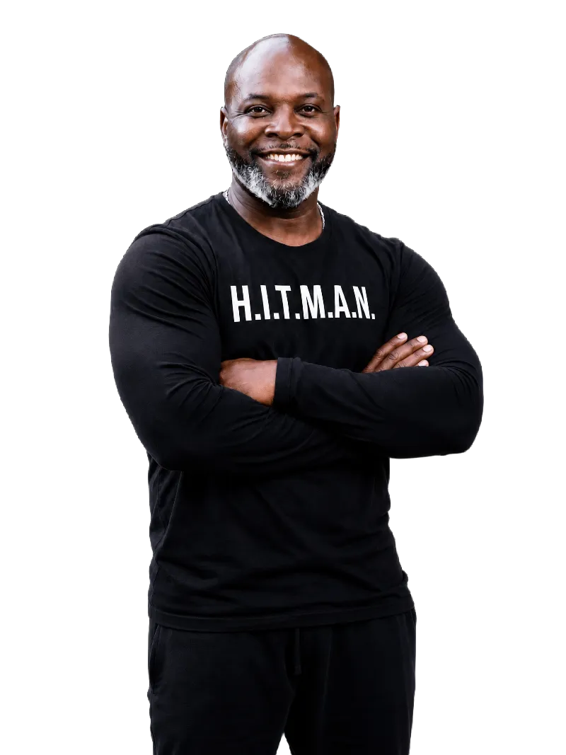 Malik Lee — The H.I.T.M.A.N., wearing his signature H.I.T.M.A.N. shirt